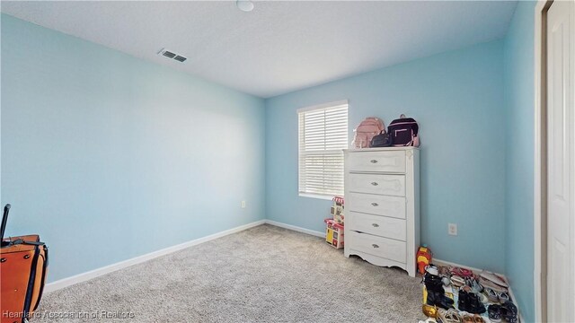 1076 Sugarwood St, Davenport, FL 33837 - bedroom featuring carpet flooring and baseboards