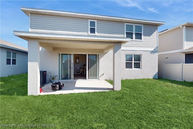 1076 Sugarwood St, Davenport, FL 33837 - back of house with stucco siding and a patio area
