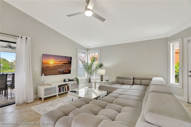 tiled living room featuring a healthy amount of sunlight, lofted ceiling, and crown molding