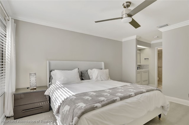 carpeted bedroom featuring ensuite bathroom, ceiling fan, and crown molding