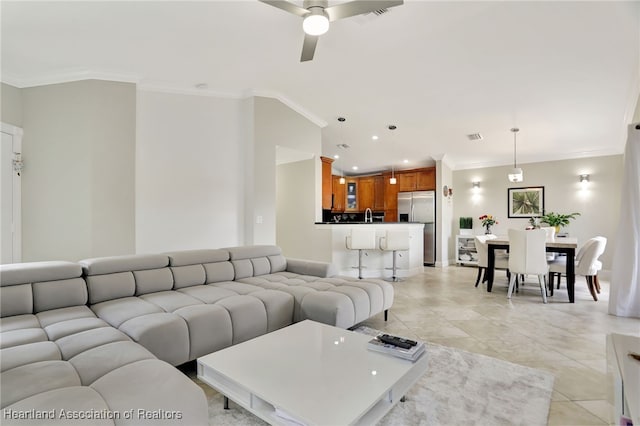 living room featuring ceiling fan and crown molding