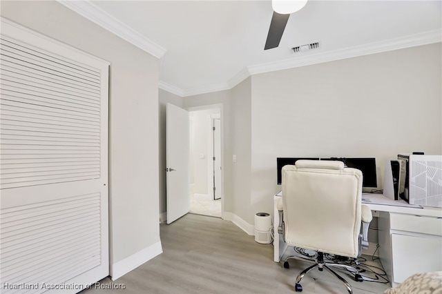 office area with light hardwood / wood-style floors, ceiling fan, and crown molding