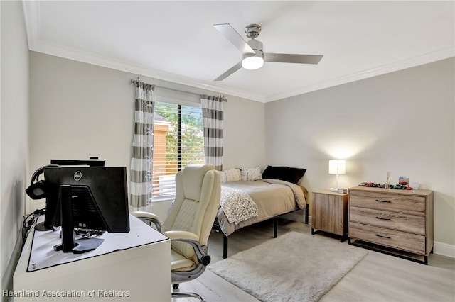 bedroom featuring light wood-type flooring, ceiling fan, and crown molding