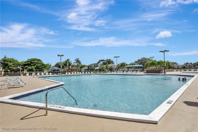 view of swimming pool with a patio