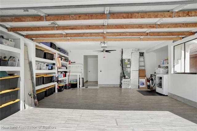 garage with ceiling fan, separate washer and dryer, and heating unit