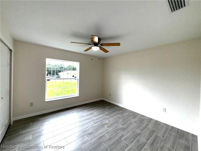 unfurnished room featuring ceiling fan