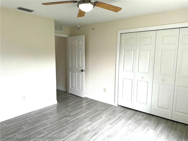 unfurnished bedroom with a closet and ceiling fan