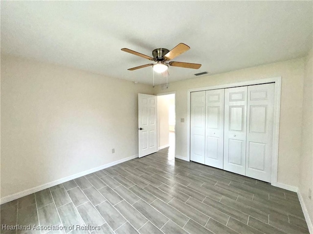 unfurnished bedroom with a closet and ceiling fan