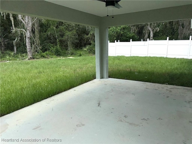 view of patio featuring ceiling fan