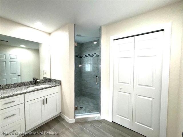 bathroom with vanity and walk in shower