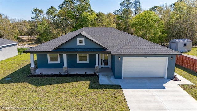 view of front of home featuring a front yard, a garage, driveway, and stucco siding