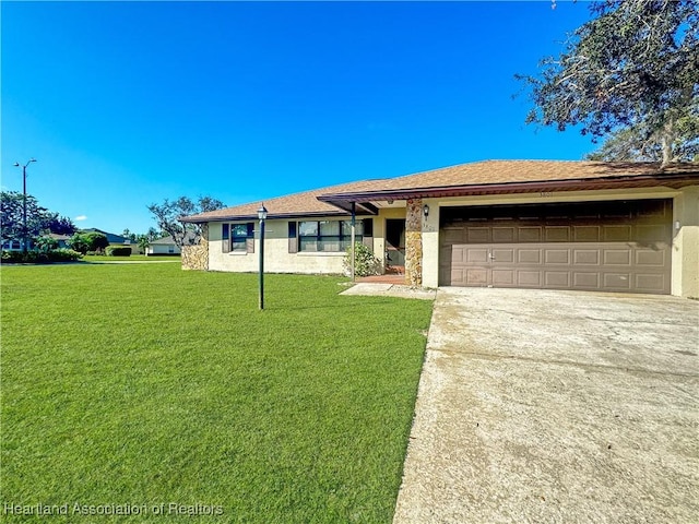 single story home featuring a front yard and a garage