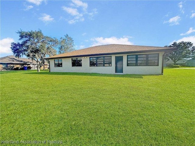 back of house with a yard