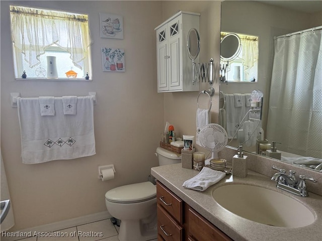 1502 Paper Birch St, Lake Placid, FL 33852 - full bath featuring toilet, vanity, tile patterned floors, a shower with curtain, and baseboards