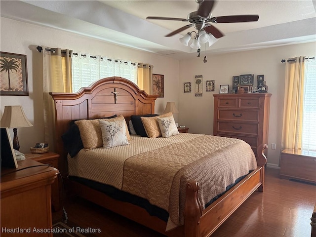 1502 Paper Birch St, Lake Placid, FL 33852 - bedroom with wood finished floors, a ceiling fan, and baseboards