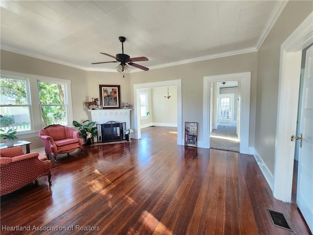 living room with visible vents, a healthy amount of sunlight, and a fireplace with flush hearth