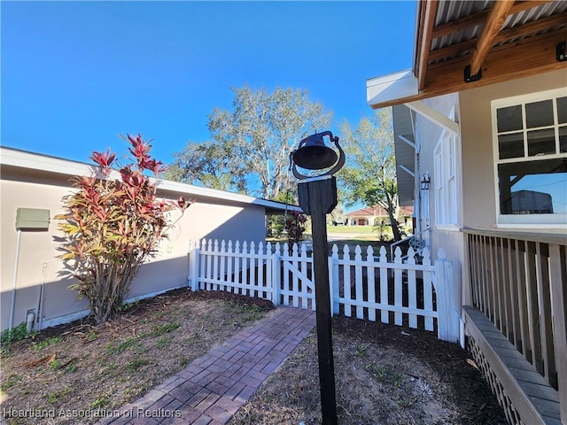 view of home's exterior with fence