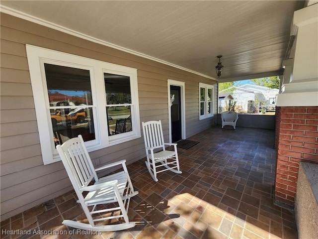 view of patio featuring a porch