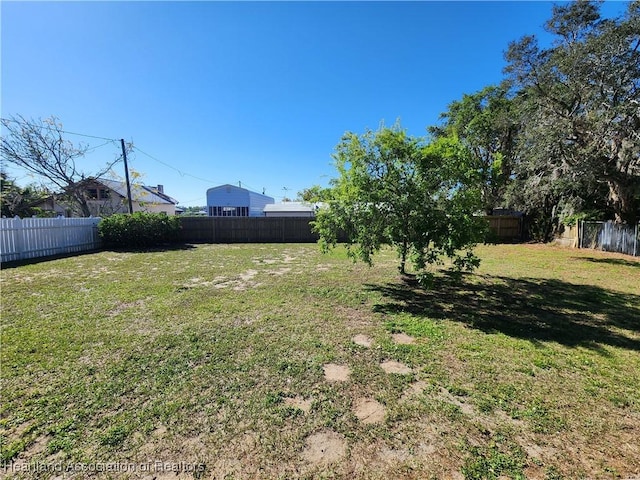 view of yard with a fenced backyard