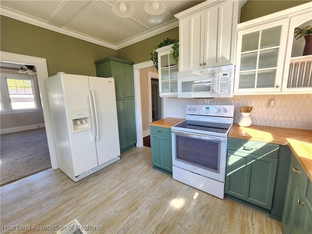 kitchen with wooden counters, green cabinets, crown molding, light wood-style flooring, and white appliances