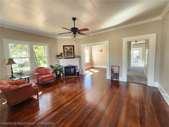 living room with plenty of natural light, a fireplace with flush hearth, and hardwood / wood-style floors