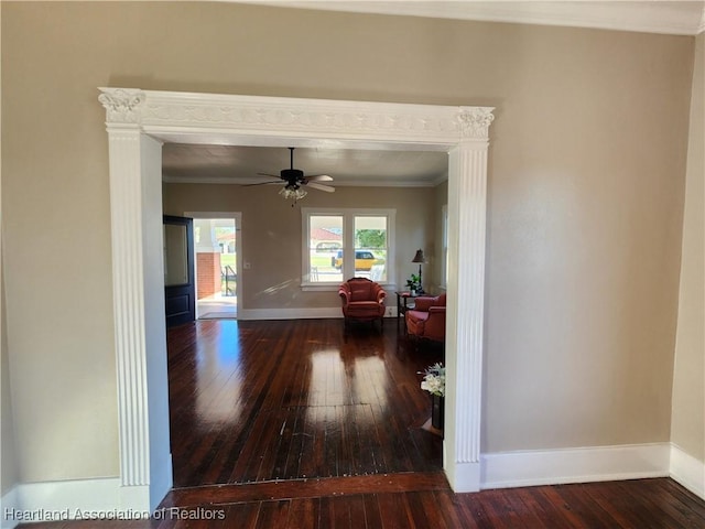 hall with baseboards, ornamental molding, and hardwood / wood-style flooring