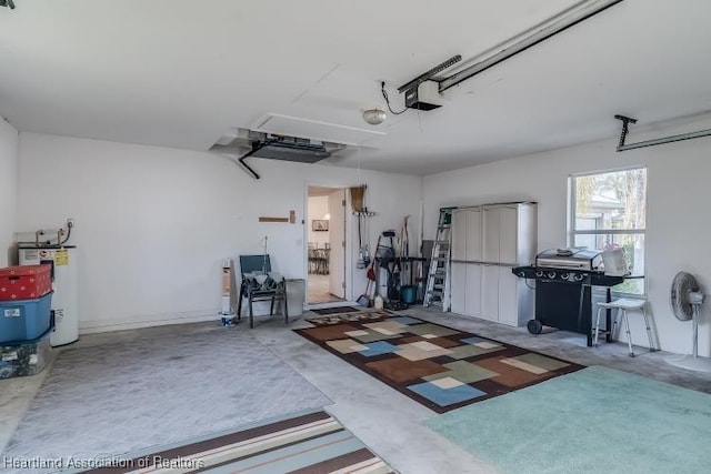 garage featuring a garage door opener and water heater