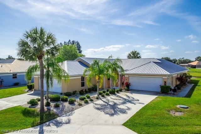 ranch-style house featuring stucco siding, concrete driveway, a front yard, and an attached garage