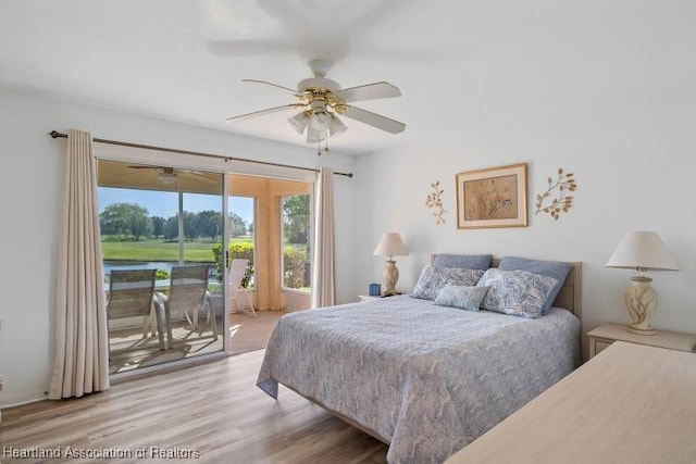 bedroom with light wood finished floors, ceiling fan, and access to outside