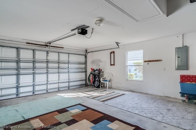 garage featuring a garage door opener and electric panel