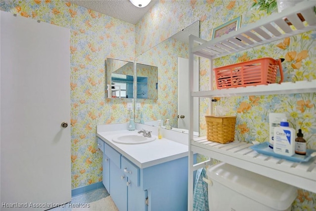 bathroom featuring vanity and a textured ceiling