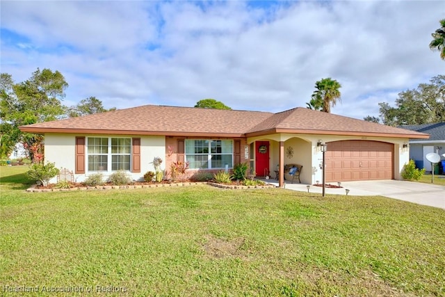 ranch-style house featuring a garage and a front lawn