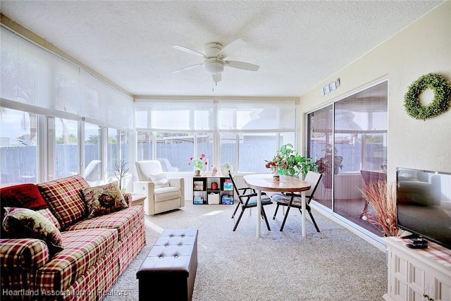 sunroom featuring plenty of natural light and ceiling fan