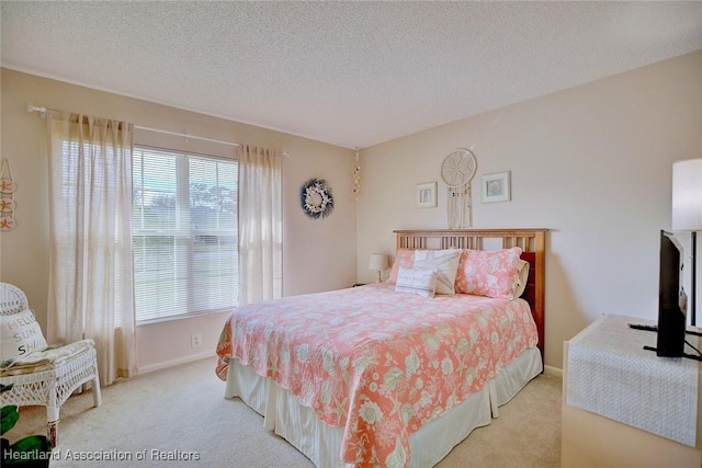 carpeted bedroom with multiple windows and a textured ceiling