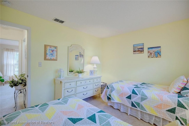 bedroom with light colored carpet