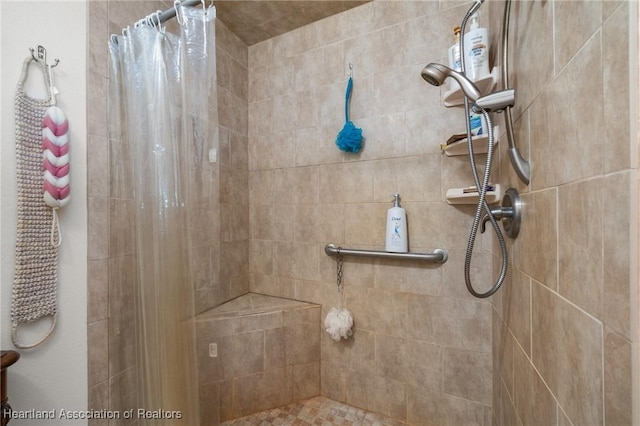 full bathroom with a tile shower
