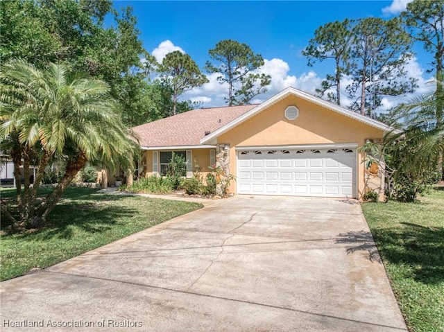 single story home with an attached garage, concrete driveway, a front lawn, and stucco siding