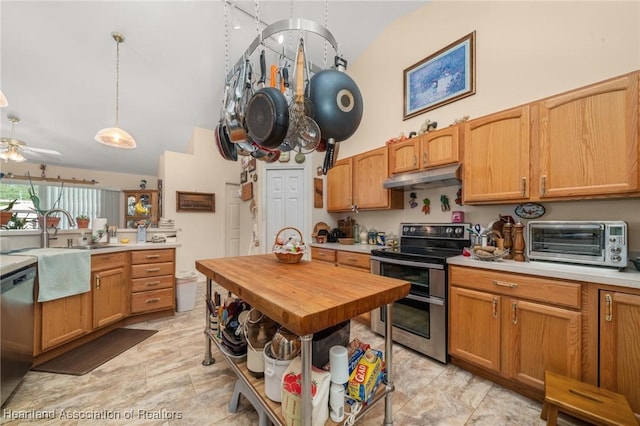 kitchen featuring stainless steel appliances, a toaster, a ceiling fan, under cabinet range hood, and high vaulted ceiling