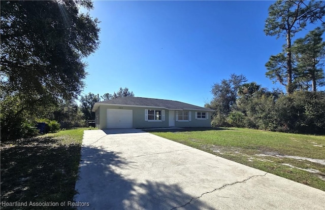 ranch-style home with a garage and a front lawn