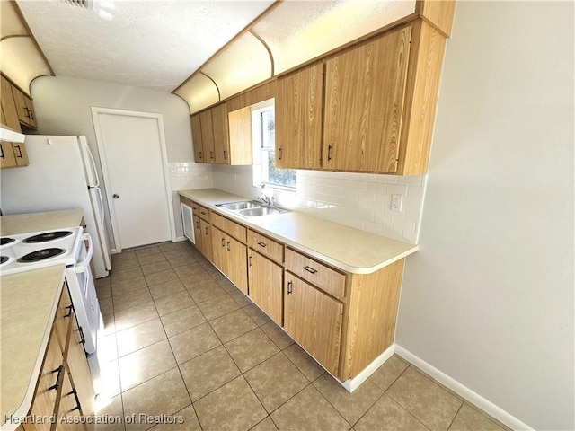 kitchen with white range with electric cooktop, decorative backsplash, light tile patterned floors, and sink