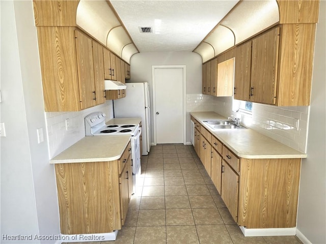 kitchen with white electric range, tasteful backsplash, light tile patterned floors, and sink