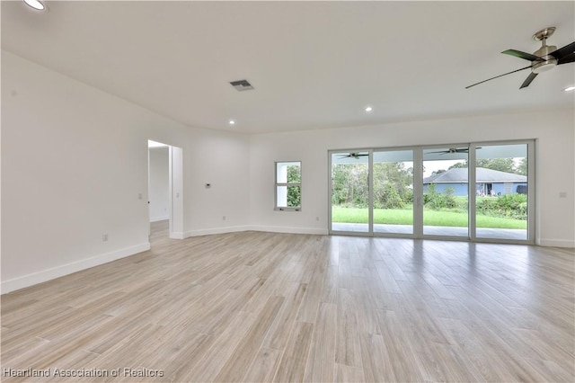 unfurnished room with light wood-type flooring and ceiling fan