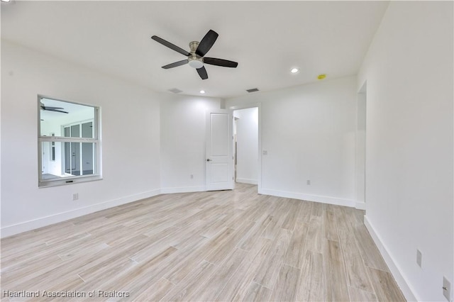 unfurnished room with ceiling fan and light hardwood / wood-style flooring