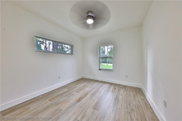 empty room featuring ceiling fan and light hardwood / wood-style floors