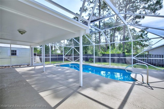 33064 Grand Prix Dr, Sebring, FL 33872 - view of swimming pool featuring a fenced backyard, a patio area, and a lanai