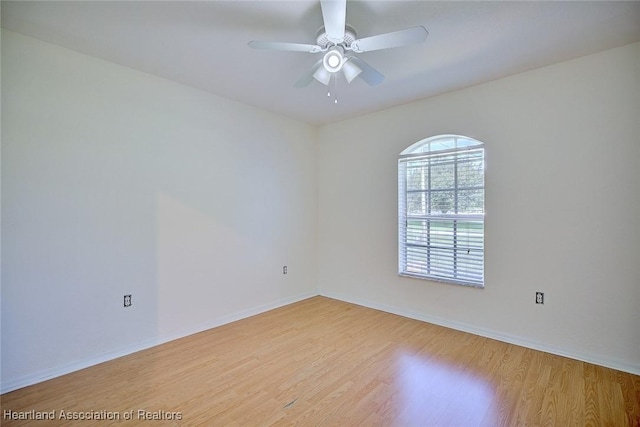 33064 Grand Prix Dr, Sebring, FL 33872 - spare room featuring light wood finished floors, ceiling fan, and baseboards