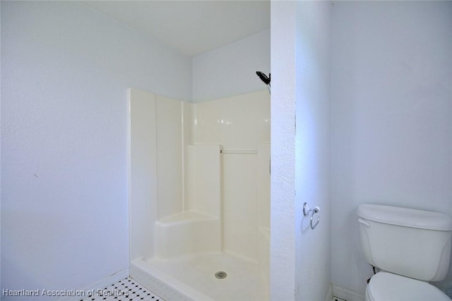 33064 Grand Prix Dr, Sebring, FL 33872 - full bathroom featuring baseboards, a shower, toilet, and tile patterned floors