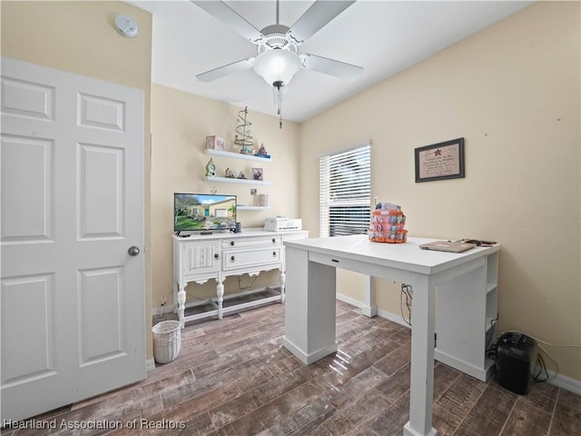 office area featuring ceiling fan, dark wood finished floors, and baseboards