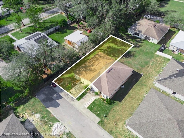 birds eye view of property with a residential view