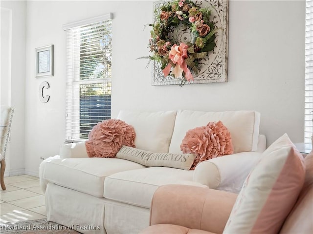 living room with light tile patterned floors and baseboards